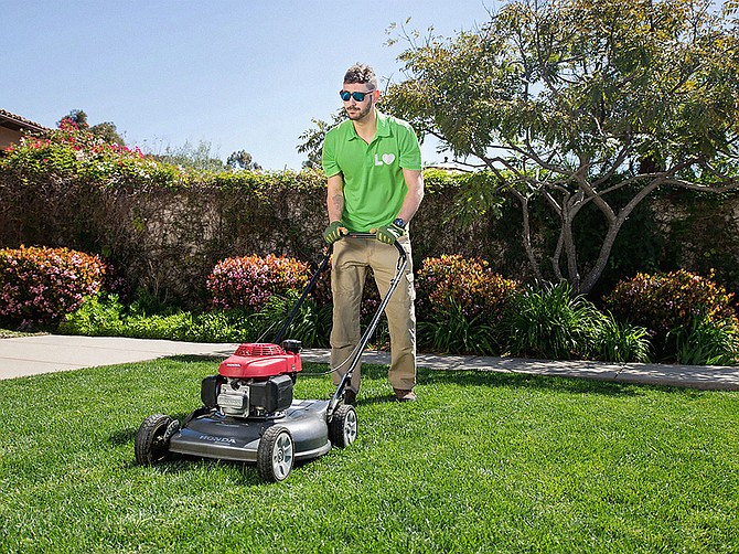 Photo courtesy of Lawn Love.
A technician from startup Lawn Love mows a client’s lawn in the 4S Ranch development of San Diego.