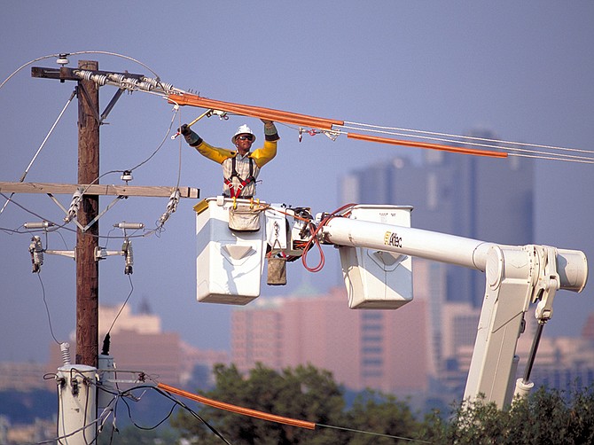 Photo courtesy of Sempra
A specialist tends to power lines at Sempra’s Texas utility, Oncor. Sempra plans to increase capital expenditures for the Texas utility, whose territory includes the Dallas, Fort Worth and Austin metro areas.