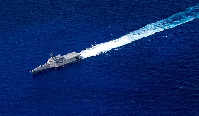 The Littoral Combat Ship USS Jackson, based in San Diego, transits the Pacific Ocean on Aug. 3. Three contractors received
awards to sustain such ships during the next few years. Photo courtesy of U.S. Navy.