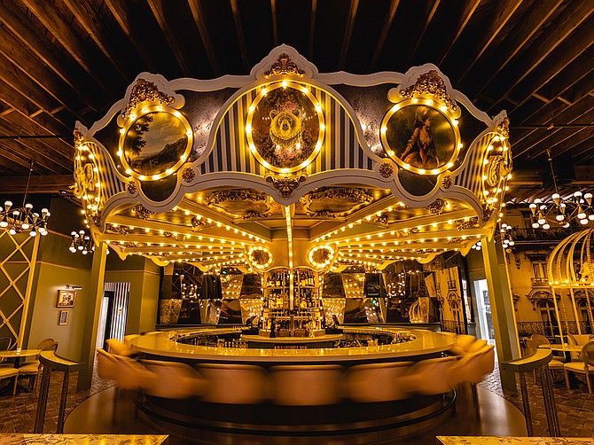 Photo Courtesy of Wolfie’s Carousel Bar
Wolfie's Carousel Bar, opened earlier this month, is a Parisian-themed food and beverage place that has a rotating bar in the center.